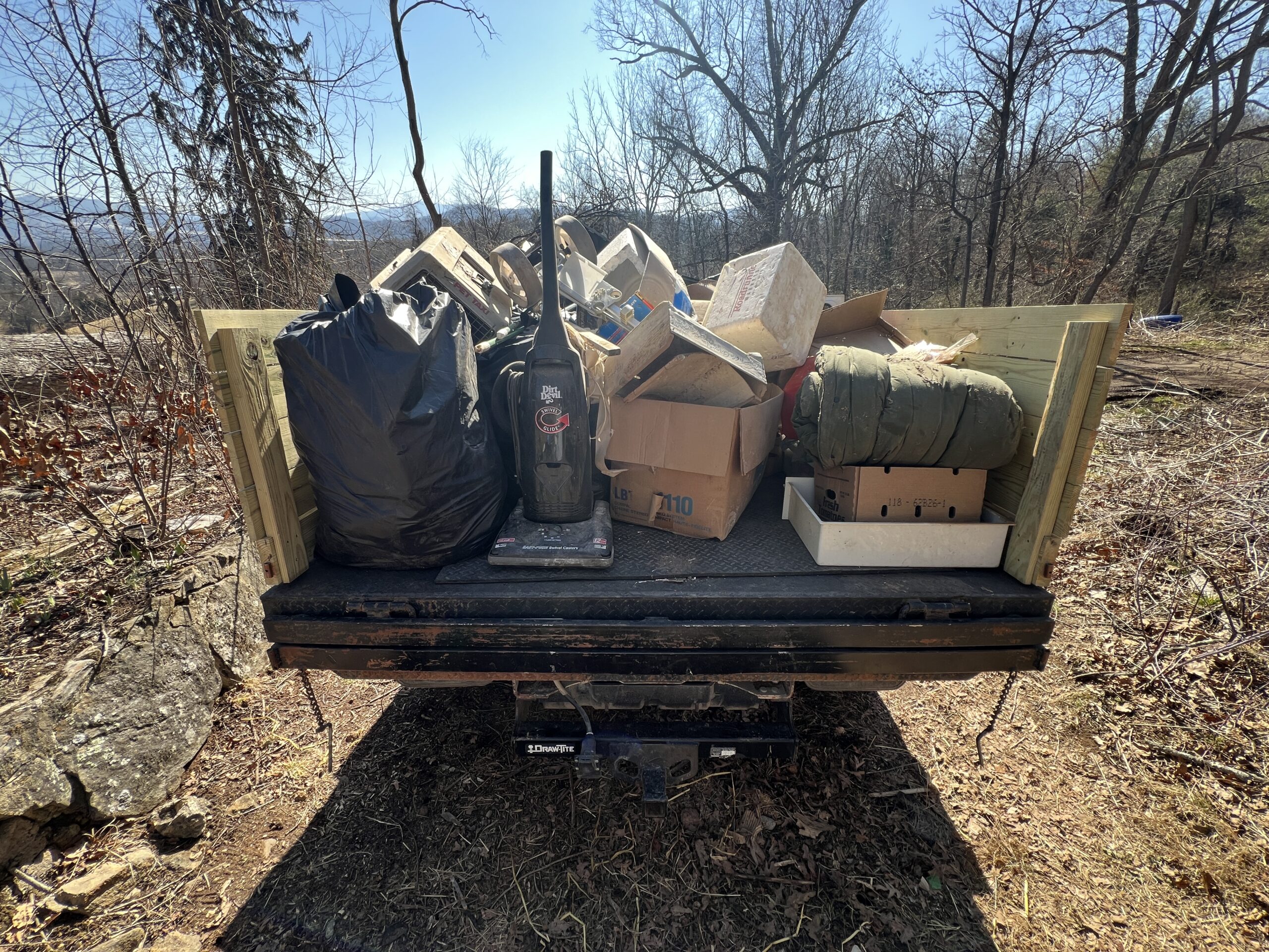 Debris removed during rural property cleanout in Western North Carolina loaded onto Grindhouse Services truck