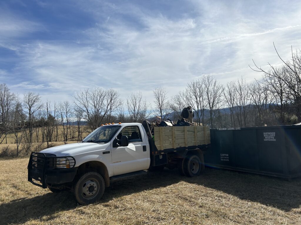 flatbed truck being emptied during barn cleanout