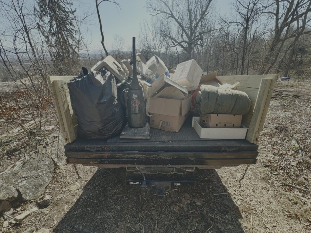 Debris removed during rural property cleanout in Western North Carolina loaded onto Grindhouse Services truck